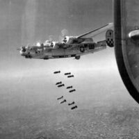 B-24L Liberator 44-49750 'Dogpatch Express', 459th Bomb Group 756th Bomb Squadron drop bombs on a rail bridge at Padua c. January 1945.