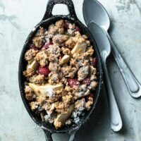apple and red lentil crumble in an ovenproof dish.